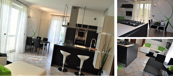 cucina con penisola e foglia verde