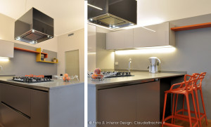 cucina grigio chiaro e scuro in vetro con particolari arancio